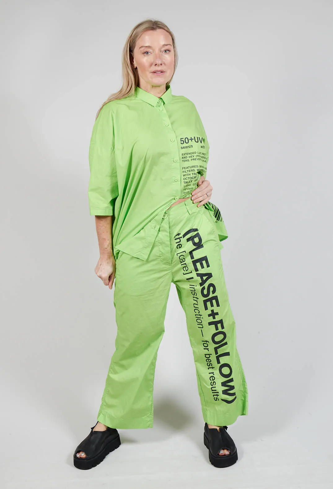 Wide Leg Trousers with Lettering Motif in Lime Print